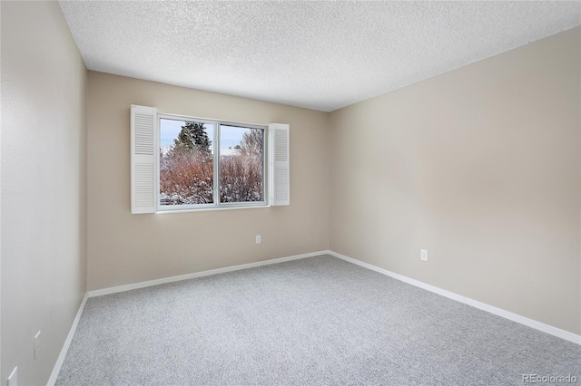 4400 S Quebec St Unit 108L, Denver, CO 80237 - carpeted empty room featuring a textured ceiling and baseboards