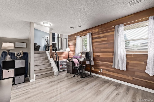 4416 E 93rd Pl, Thornton, CO 80229 - office space with a textured ceiling, wood walls, and wood finished floors