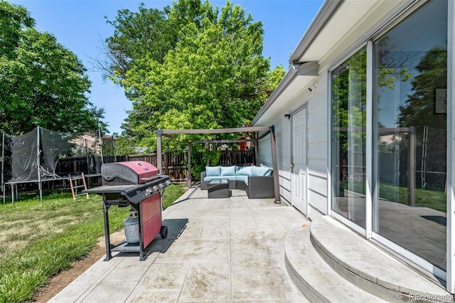 4416 E 93rd Pl, Thornton, CO 80229 - fenced backyard with a trampoline, a patio area, an outdoor hangout area, and grilling area