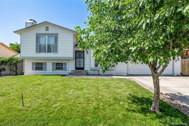 4416 E 93rd Pl, Thornton, CO 80229 - split level home featuring a chimney, driveway, and an attached garage