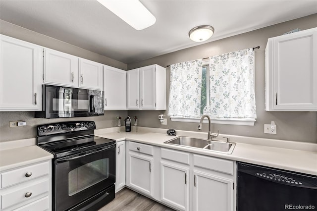 4416 E 93rd Pl, Thornton, CO 80229 - kitchen featuring black appliances, white cabinetry, light countertops, and light wood finished floors