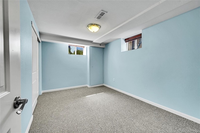 4268 S Delaware St, Englewood, CO 80110 - basement with carpet floors and a textured ceiling