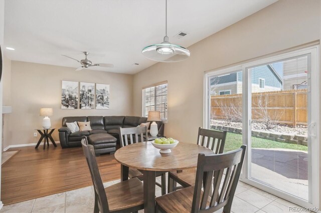 7342 S Mobile St, Aurora, CO 80016 - dining room with ceiling fan, healthy amount of natural light, light tile patterned flooring, and baseboards