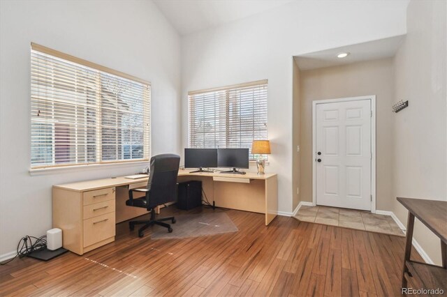 7342 S Mobile St, Aurora, CO 80016 - office space with wood-type flooring, healthy amount of natural light, and baseboards
