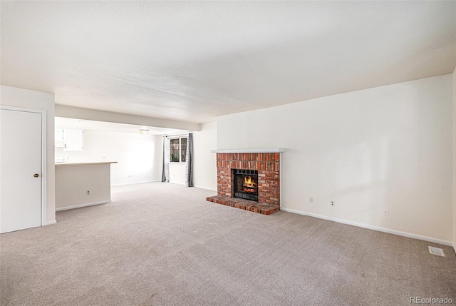 1756 S Quintero Way, Aurora, CO 80017 - unfurnished living room featuring light colored carpet and a fireplace