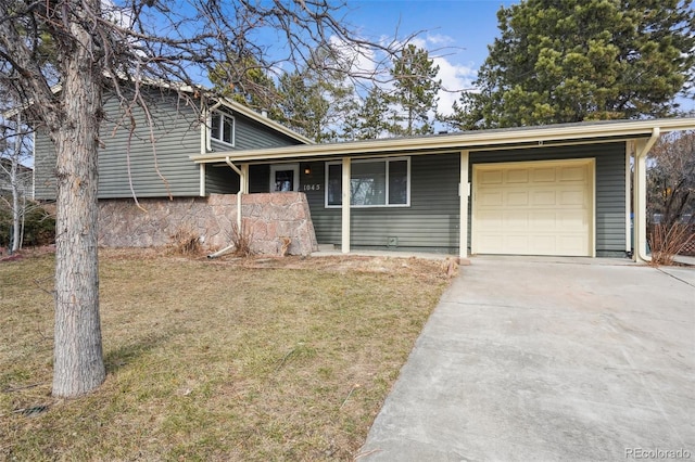 split level home featuring a garage, a front yard, and a carport