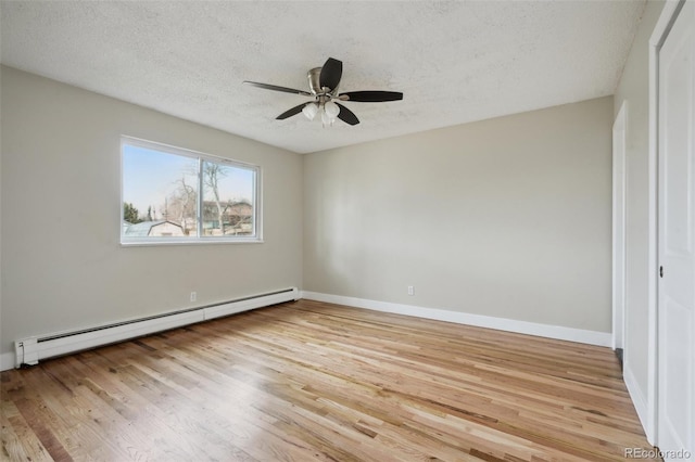 empty room with light hardwood / wood-style flooring, ceiling fan, a baseboard radiator, and a textured ceiling