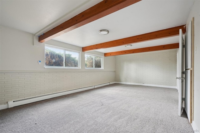 carpeted spare room with beamed ceiling, brick wall, and baseboard heating