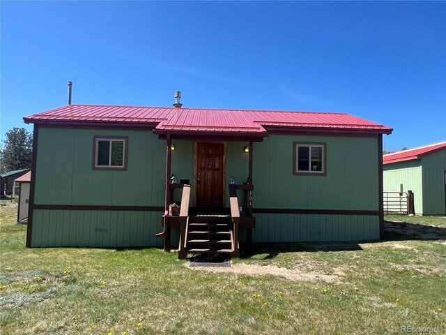 304 Cowan Rd, Bailey, CO 80421 - manufactured / mobile home featuring a front lawn and metal roof