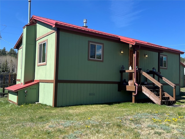304 Cowan Rd, Bailey, CO 80421 - rear view of property with metal roof and a lawn