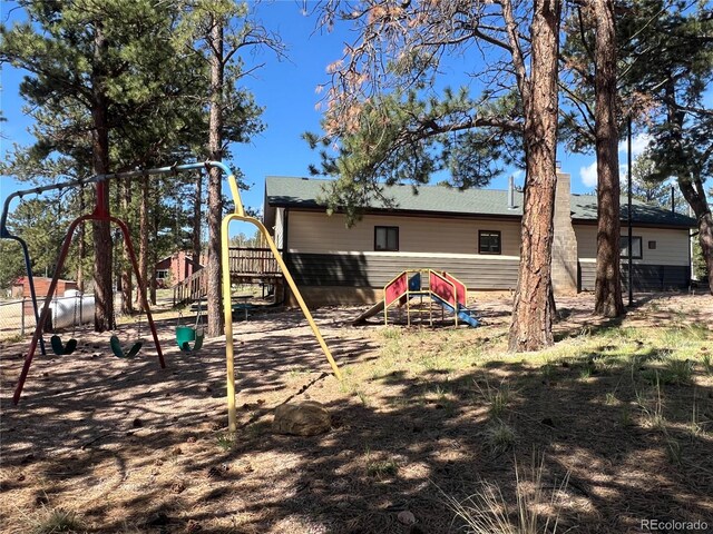 304 Cowan Rd, Bailey, CO 80421 - rear view of house featuring a playground