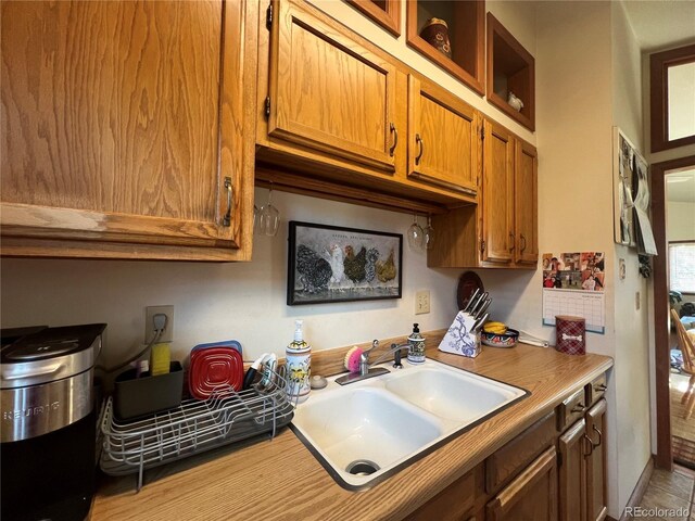 304 Cowan Rd, Bailey, CO 80421 - kitchen featuring brown cabinets, a sink, and light countertops
