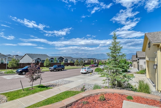 3470 Daydreamer Dr, Colorado Springs, CO 80908 - view of asphalt street featuring a residential view, sidewalks, and curbs
