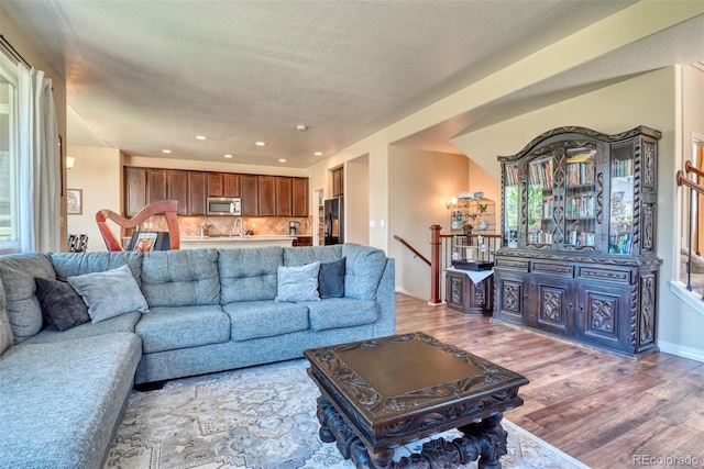3470 Daydreamer Dr, Colorado Springs, CO 80908 - living area featuring wood finished floors and recessed lighting
