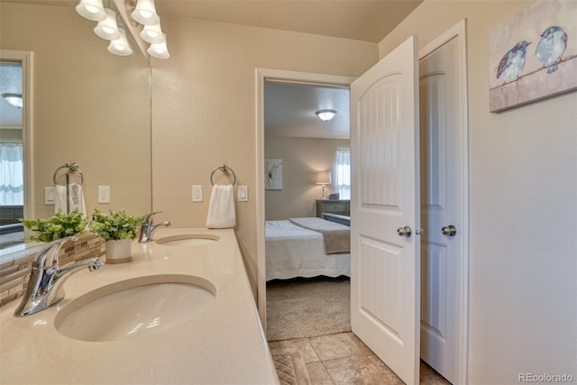 3470 Daydreamer Dr, Colorado Springs, CO 80908 - bathroom with ensuite bath, healthy amount of natural light, double vanity, and a chandelier