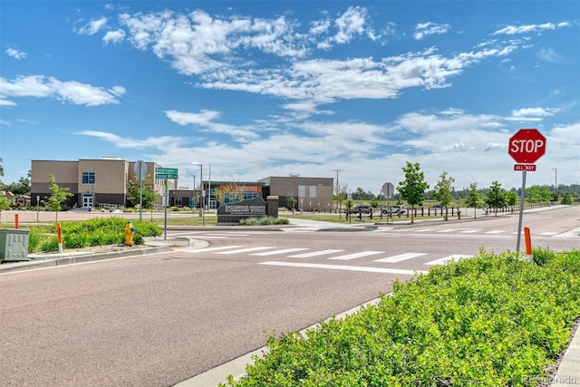 3470 Daydreamer Dr, Colorado Springs, CO 80908 - view of asphalt street featuring traffic signs, sidewalks, and curbs
