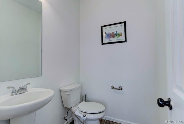 bathroom with sink and toilet