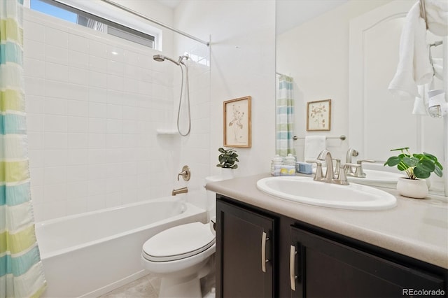 full bathroom featuring shower / bath combination with curtain, vanity, toilet, and tile patterned floors