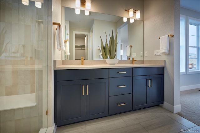 bathroom featuring vanity and a shower