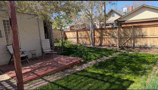 2377 Cherry St, Denver, CO 80207 - view of yard with a deck and a fenced backyard