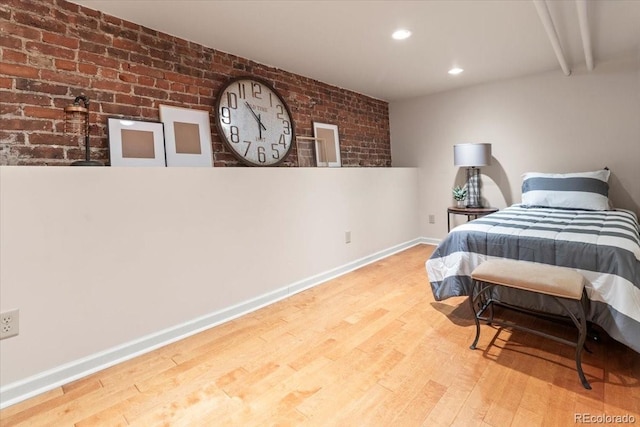 2377 Cherry St, Denver, CO 80207 - bedroom featuring baseboards, recessed lighting, brick wall, and wood finished floors