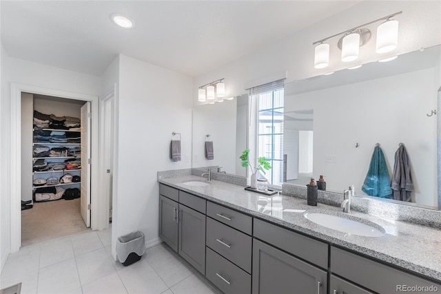 bathroom featuring tile patterned flooring and vanity