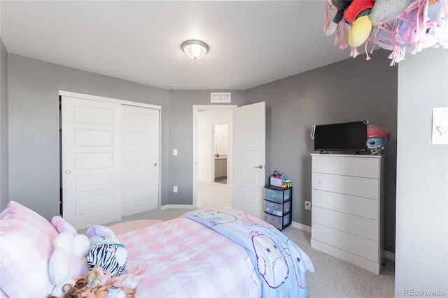 carpeted bedroom featuring a closet