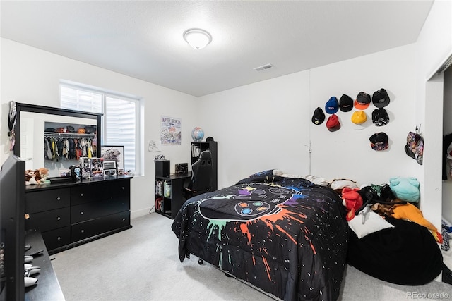 bedroom featuring a closet and carpet flooring