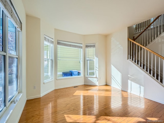 unfurnished living room with light wood-type flooring