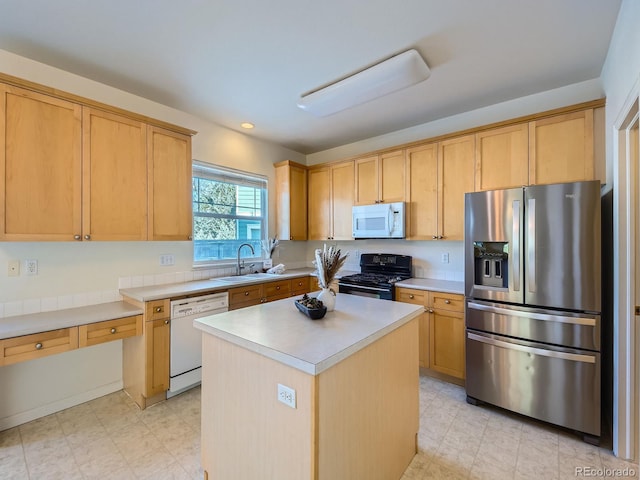 kitchen featuring white appliances, sink, a kitchen island, and light brown cabinets