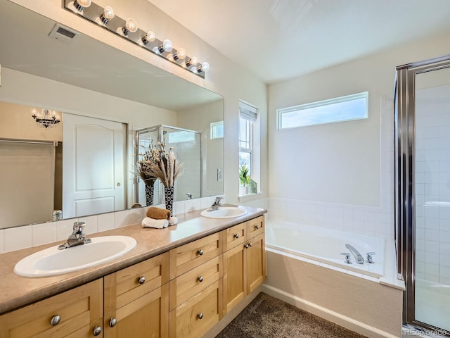 bathroom featuring vanity and separate shower and tub