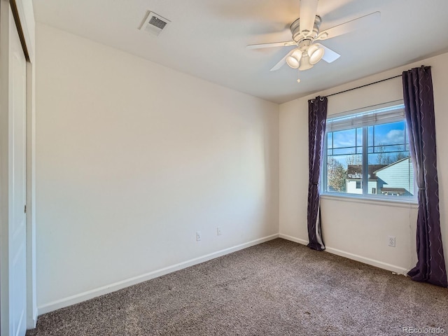 carpeted empty room with ceiling fan