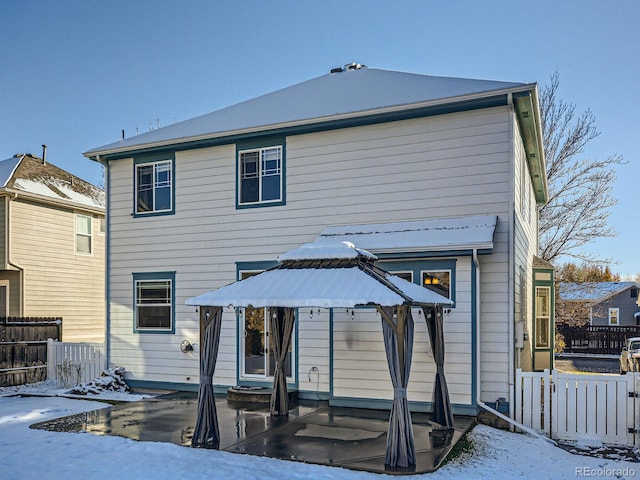 view of snow covered house