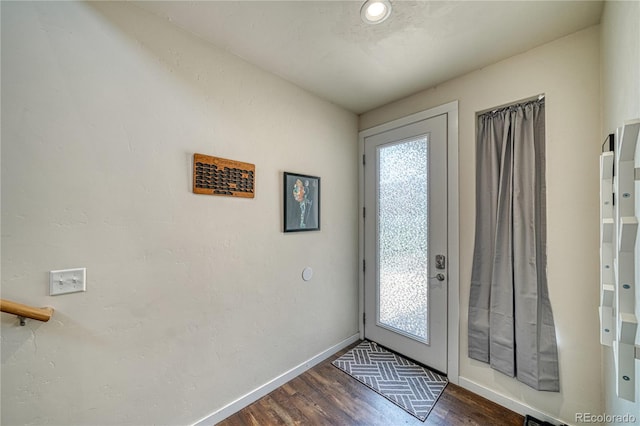 728 Oak St Unit F, Salida, CO 81201 - entrance foyer featuring dark wood-style flooring and baseboards