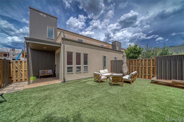 728 Oak St Unit F, Salida, CO 81201 - back of property featuring a patio and an outdoor hangout area
