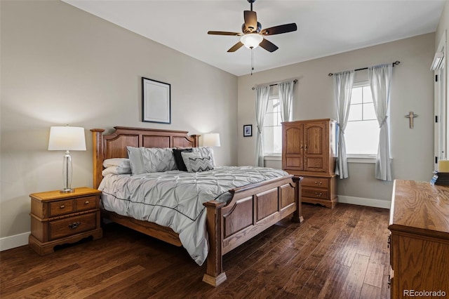 bedroom with dark wood-type flooring, ceiling fan, and baseboards