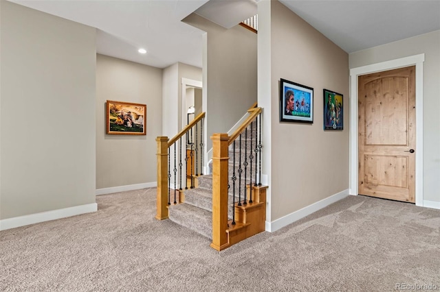 staircase featuring recessed lighting, carpet flooring, and baseboards