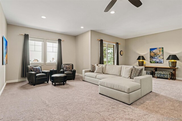 living room featuring recessed lighting, carpet, and baseboards