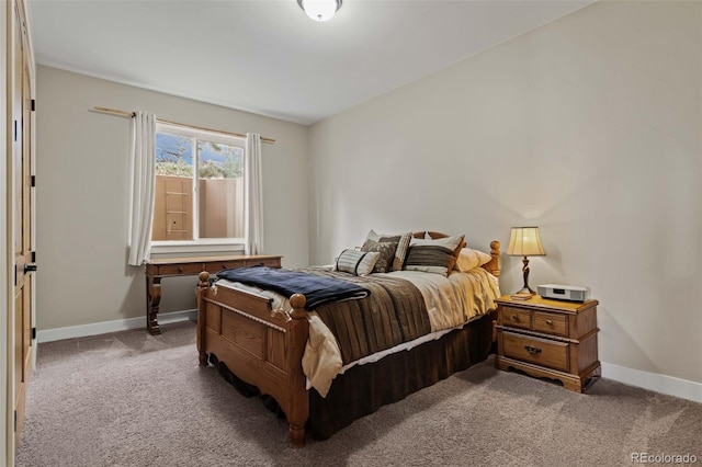bedroom featuring baseboards and carpet flooring