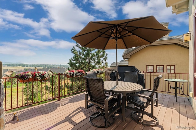 deck featuring outdoor dining area