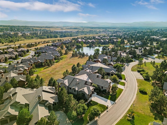 birds eye view of property with a residential view and a water and mountain view