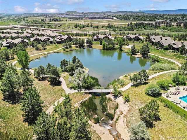 drone / aerial view featuring a water view and a residential view