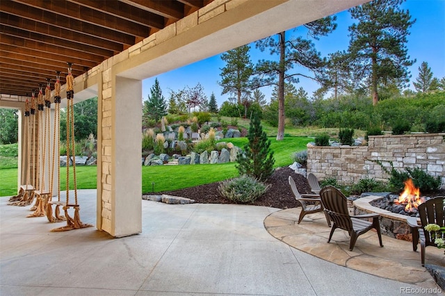 view of patio featuring a fire pit