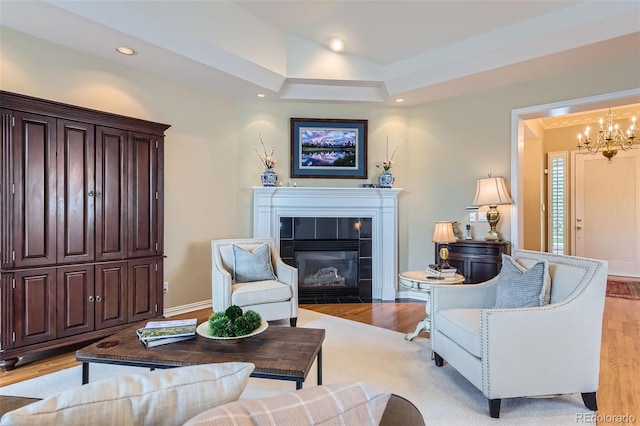 32 Silver Fox Cir, Greenwood Village, CO 80121 - living room with a chandelier, light wood-type flooring, a fireplace, recessed lighting, and baseboards