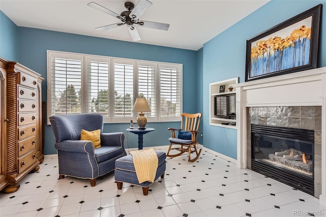 32 Silver Fox Cir, Greenwood Village, CO 80121 - sitting room with ceiling fan and a glass covered fireplace