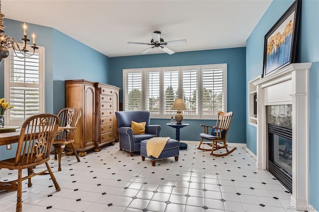 32 Silver Fox Cir, Greenwood Village, CO 80121 - sitting room featuring ceiling fan, a chandelier, baseboards, and light flooring