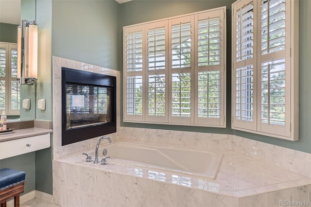 32 Silver Fox Cir, Greenwood Village, CO 80121 - bathroom featuring a garden tub and vanity
