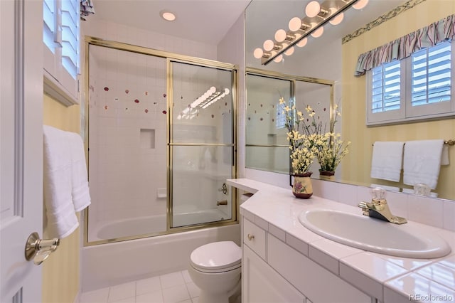 32 Silver Fox Cir, Greenwood Village, CO 80121 - bathroom featuring vanity, toilet, bath / shower combo with glass door, and tile patterned floors