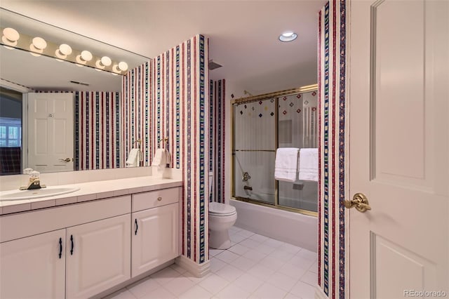 32 Silver Fox Cir, Greenwood Village, CO 80121 - full bath featuring vanity, bath / shower combo with glass door, toilet, tile patterned flooring, and recessed lighting