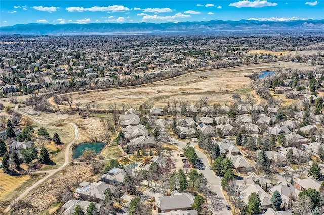 32 Silver Fox Cir, Greenwood Village, CO 80121 - aerial overview of property's location with a mountain backdrop and nearby suburban area